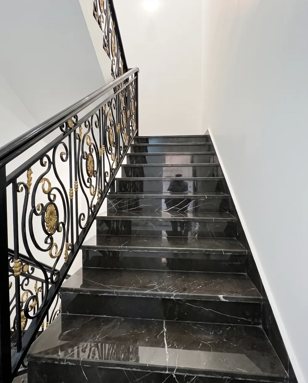 Polished black marble staircase