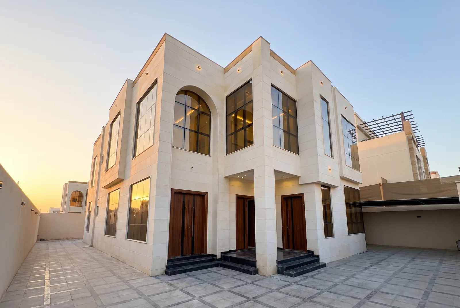 Clean villa exterior at sunset